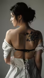 a woman with an ornate back tattoo