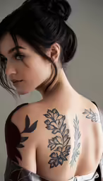 woman wearing a wedding dress and tattoo back