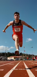 the man is jumping in the air with his legs up