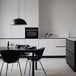 an elegant kitchen with black accents and white cabinets