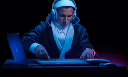 a man dressed in headphones and using a computer
