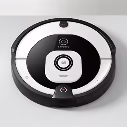 an eco robot cleaning the room with its black and white attachment