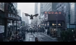 an image of city with a pigeon flying over it