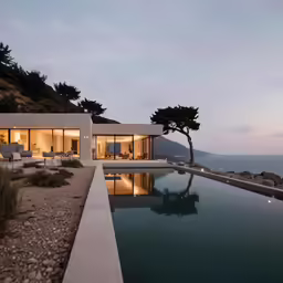 the pool at the house is near some mountains