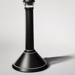 a black lamp on white background is shown in this image