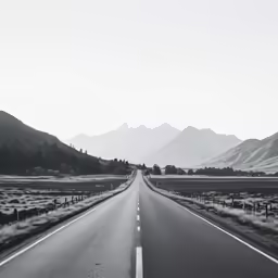 a wide open highway in the mountains
