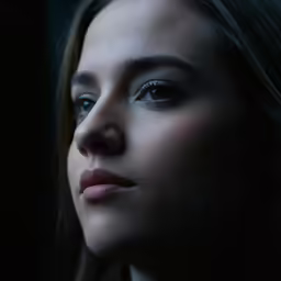 the image shows an artistic portrait of a young woman