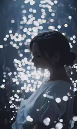 a woman is looking down at some lights