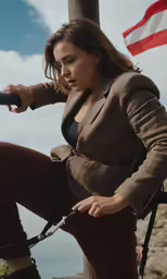 a woman sits on a pole holding a phone