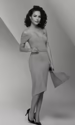 the model in an off - shoulder dress is posing with an umbrella