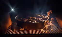a skillet full of sausage cooking in a stove