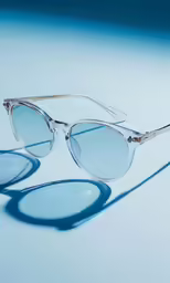 glasses are shaped like a circle on blue background