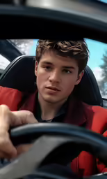 a man driving in the car has his hands on the steering wheel
