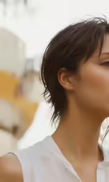 a woman wearing white shirt standing in front of a sign
