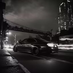 the car is parked on the road in front of some buildings