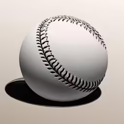 a white baseball is placed on a black plate