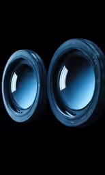 two blue speakers are shown with black background