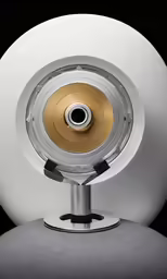 a white and gold sphere lamp on a black background