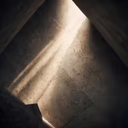an empty concrete floor has the sunlight shining in