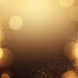 some gold sparkles are glowing on the dark background