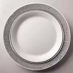 an empty plate with intricately designed edges
