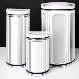 three white trash cans on a table and one in black