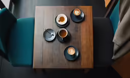 a very close up view of a table with two cups