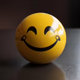 a yellow ball with black lines and a smiling face
