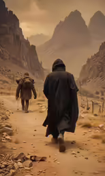 a man with a black robe and brown backpack walking on a dirt path