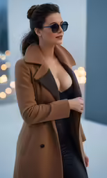a woman wearing black glasses standing near a wall