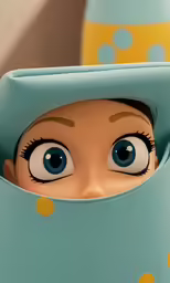 the doll has its eyes wide open while wearing a polka dotted blue cape