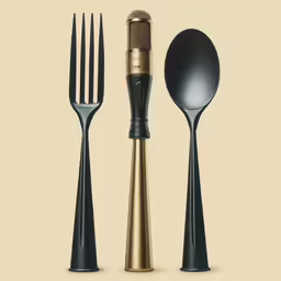 a golden mic and two forks and a spoon