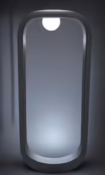 a mirror is lit in the dark with an eyeball on it