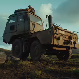 a rusted out military vehicle parked in the field