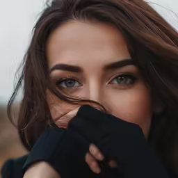 woman in black shirt holding her right arm out