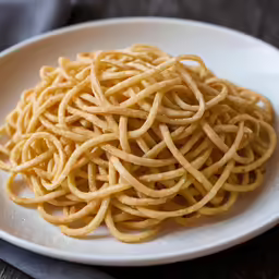 a plate full of noodles and noodles for dinner