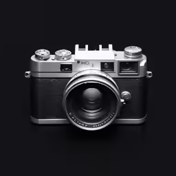 an old camera sitting on a black surface