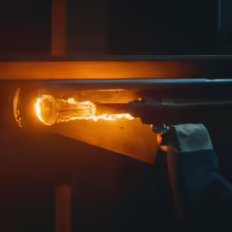 light bulb being made in a dark room