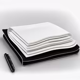 some black and white papers are stacked up with a black pen