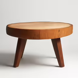 a small wooden stool on a plain white surface