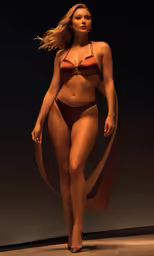a woman wearing a bikini walking down the runway