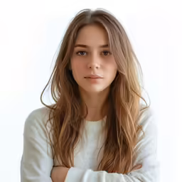 an attractive young woman standing against a white background