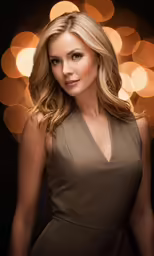 beautiful woman in brown dress posing for photo