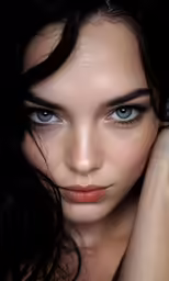 the beautiful young lady has her hand on her head