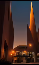the tall structures of an outside architecture are illuminated