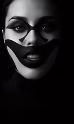 a woman in makeup has some interesting black lines on her face
