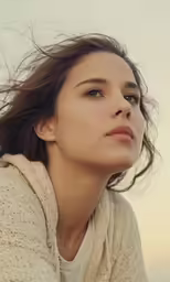 a woman standing in the air with hair flying