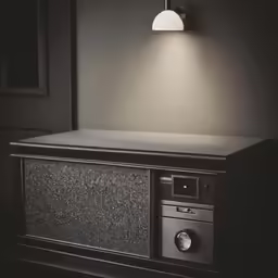 a small portable radio sitting under a light