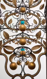 a metal sculpture with various types of ornaments on it