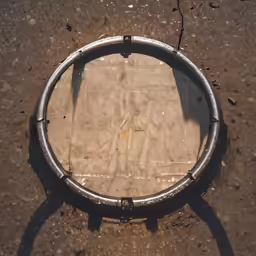 a circle shaped object sitting on top of cement